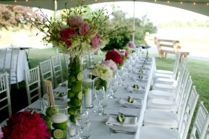 Groupings of pink, green and white flowers highlighted by tall arrangements of peonies and orchids. Love the lime accents!